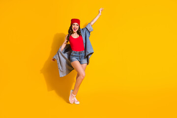 Full length body size view of her she nice-looking attractive lovely slender glamorous cheerful wavy-haired girl dancing having fun isolated over bright vivid shine vibrant yellow color background