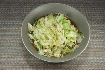 Fried sliced fresh cabbage with traditional soy sauce and pepper. Famous vegetarian menu in Asia. High fiber and nutrition menu. Low fat and diet food. 