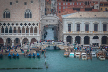 Tilt shift effect of tourists watching the Sospiri Bridge, Venice, Italy. Concept: mass tourism in Venice