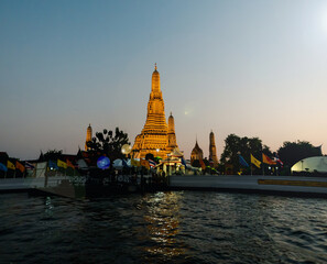 View of Chao Phraya River . Shows water transport. And Wat Arun temple.

I