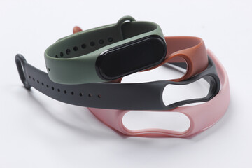 Smart bracelet with interchangeable straps on a white background. Modern gadgets