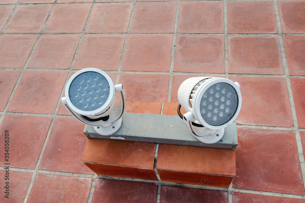 Poster led spotlight on the tile floor to illuminate the object at a high angle for the brightness of the o