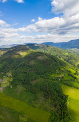 Fototapeta na wymiar panorama of beautiful countryside of Czech. sunny afternoon. wonderful springtime landscape in mountains. grassy field and rolling hills. rural scenery Czech beskydy