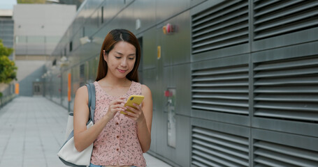 Woman work on mobile phone at outdoor