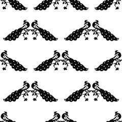 Two peacocks with feathers sitting on a branch isolated on white background is in Seamless pattern