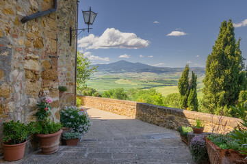 Sunny streets with colorful flowers with contrasting shades. Walk the Tuscan town © Jarek Pawlak
