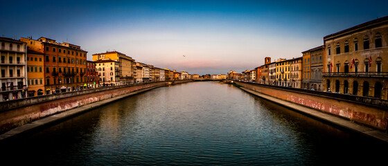 Pisa, Tuscany, Italy Arno riverscape view from bridge at sunset