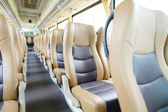 Comfortable passenger bus interior. Close-up of the rear seats, interior. Interior of modern mini bus with seats,