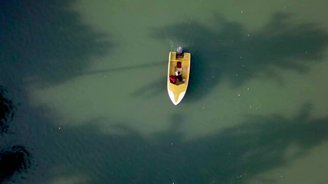 Drone shot over the sea and boats heading forward, Goa, India