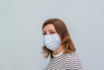woman wearing an anti-virus protection mask to prevent flu infection, allergies, virus protection, COVID-19, and corona virus pandemic disease 2019