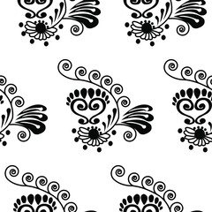 Alpona design of flowers, spirals and lord footprints is in Seamless pattern