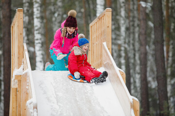 Winter fun: sliding downhill.