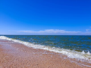 Storm on the sea of Azov in Sunny weather. Summer.