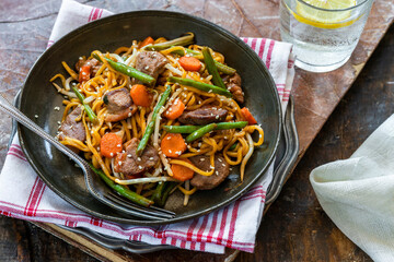 Stir fry duck fillets with noodles, vegetables and hoisin sauce