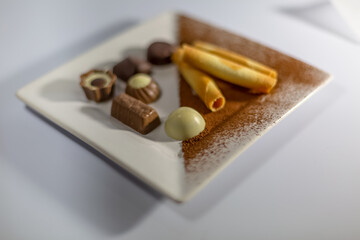 Detailed view of a delicious bonbons on white plate