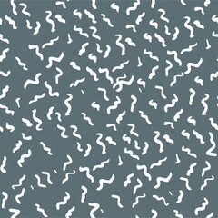 Obraz na płótnie Canvas Seamless vector pattern with little waves. Wavy freehand scribbles in Memphis style. Thin lines, dashes, and smears. Grayscale retro mosaic texture. Hand-drawn grunge ink vector illustration