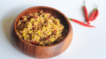 Spicy star gooseberry salad in wood bowl on white background,Thai food