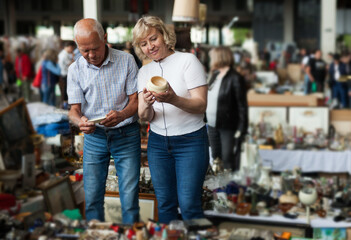 Mature family study range of flea market