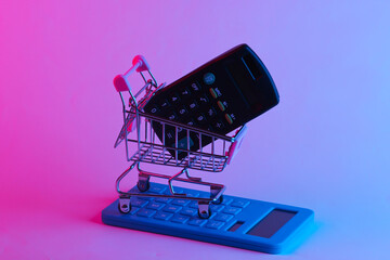 Shoping trolley with calculators in trendy neon light. Gradient pink-blue glow. Concept art. Minimalism