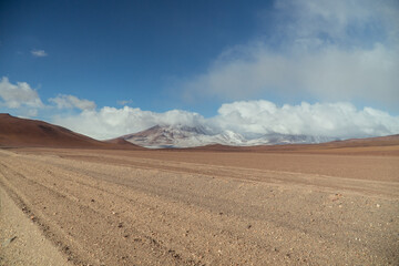 Landscape mountain Water Lake. Dry, Barren desert, snowcapped mountains wilderness. Mountain range view. Salt Flats, Uyuni, Bolivia. Copy space, Rocks, blue sky, nature, hiker, hiking
