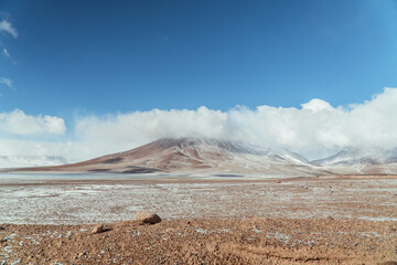 Landscape mountain Water Lake. Dry, Barren desert, snowcapped mountains wilderness. Mountain range view. Salt Flats, Uyuni, Bolivia. Copy space, Rocks, blue sky, nature, hiker, hiking