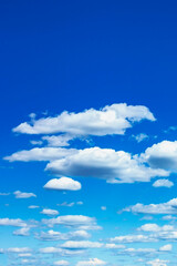 beautiful blue sky with white cumulus clouds as a natural background