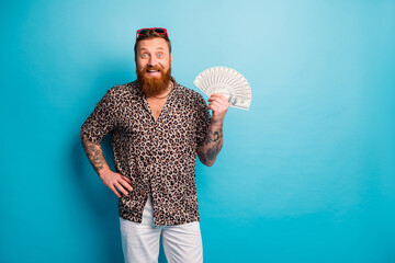 Photo of macho guy hold fan american bucks excited mood tattoo body hands ready spend waste money...