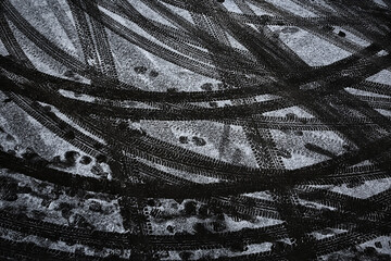 tire tracks on snow road, texture winter road, ice, motor transport danger background