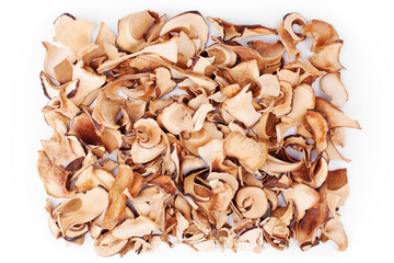 Edible dried mushrooms pile on white background close up, dry boletus edulis heap, chopped brown cap boletus, sliced penny bun, pieces of cep, porcino or porcini, cutted white fungus texture top view