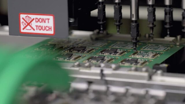 Detail of logic boad assembly by machine