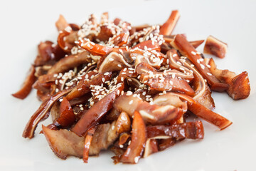 Grilled Pork Ears Over White Background. Beer Snack.