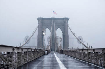 Brooklyn bridge, New York City. USA. New York in a foggy day in downtown Manhattan.