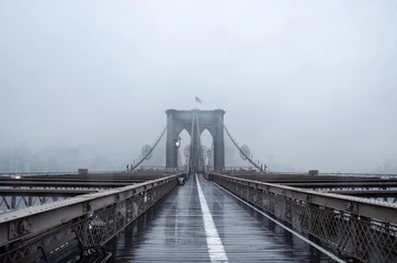 Fototapeten Brooklyn bridge, New York City. USA. New York in a foggy day in downtown Manhattan. © Elena Titova