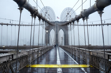 Brooklyn bridge, New York City. USA. New York in a foggy day in downtown Manhattan.