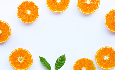 Frame made of orange fruit on white background.