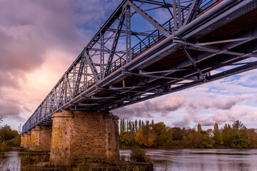 sunset on bridge over the river Loire in France