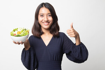 Healthy Asian woman thumbs up with salad.