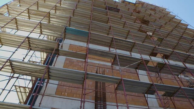 Low Angle Construction Site. External Wall Scaffold