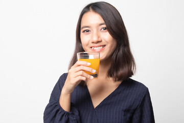 Young Asian woman drink orange juice.