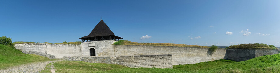 Summer panoramas overlooking the gate of the old fortress in the city of Khotyn