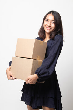 Delivery, relocation and unpacking.  young asian woman holding cardboard box.
