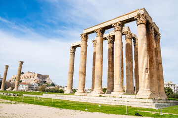 Ruins of the ancient Temple of Olympian Zeus in Athens with Acropolis hill in the background