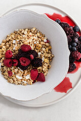 Healthy and nutritious breakfast. Granola with berries in a rust