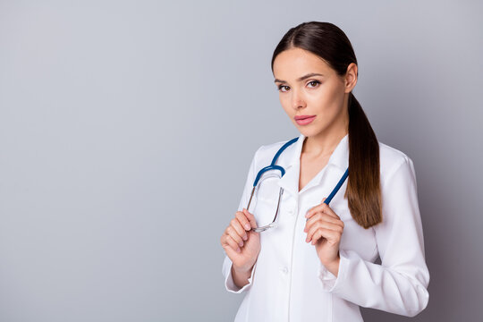 Portrait photo of attractive serious family doc experienced skilled professional listen attentively patient complaining wear medical uniform lab coat stethoscope isolated grey background