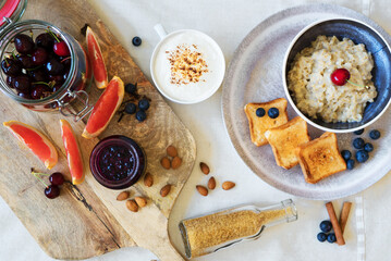 Healthy breakfast. Oat Flakes Porridge with toasts and fruits.
