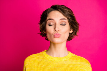 Fototapeta premium Close-up portrait of her she nice attractive lovely dreamy sweet pretty lovable cute shy feminine cheery girl sending air kiss isolated on bright vivid shine vibrant pink fuchsia color background