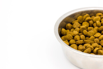 Steel bowl of pet food isolated on white background. Close up. Space for text. Pets care veterinary concept.