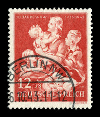 Berlin, GERMANY — 6 october 1943: German historical stamp: Mother with child. Anniversary issue dedicated to the 10th anniversary of the organization "Winter Relief of the German People (WHW)".

