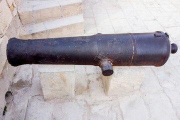 steel cannon in the castle of alicante