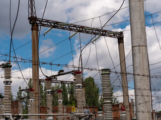 Transformer station near the power station. High voltage electrical wires.